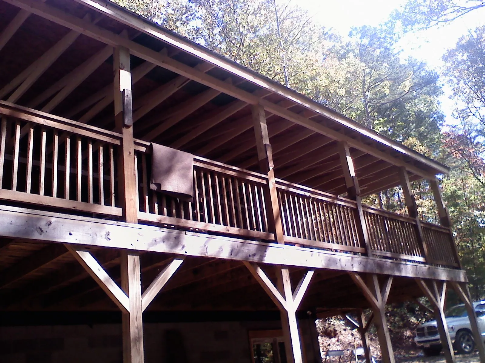 Timber framing under a new elevated porch and deck — Roof Leak Repair in Mills River by Roofing Brothers